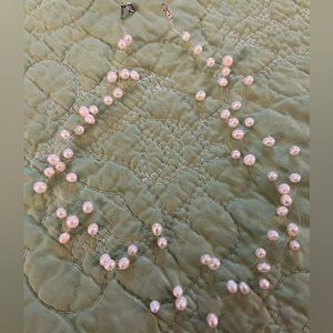 Floating genuine pearl choker necklace.